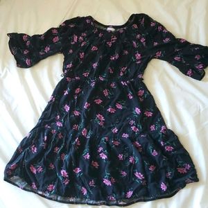 Black floral dress with flared elbows